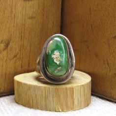 "Sterling silver and green turquoise ring. Heavy silver, a large stone with a rustic look. The front is 1 1/16\" tall x 11/16\" wide. Nice double shank.   There are tan matrix in the stone. Good condition with a natural patina. *The color on your screen may not reflect the actual stone color due to monitor variations.*" Large Stone, Green Turquoise, Tucson, Matrix, Turquoise Ring, Stone Color, Patina, Jewelry Rings, Ring Size