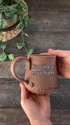 someone is holding a coffee mug with the words carving a mug bumm on it