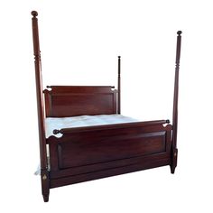 a wooden bed with four posts and white sheets on the bottom, against a white background