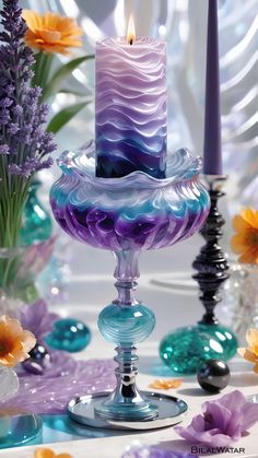 there is a candle that is sitting on a glass stand with flowers in the background