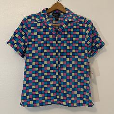 Nwt- Notations Vintage Multicolored 80s Button Up Blouse. Funky Colors Size M Cheap Retro Button-up Blouse, 80s Button Up Shirt Outfit, Multicolor Retro Print Button-up Top, Retro Multicolor Button-up Shirt, Vintage Multicolor Tops With Button Closure, 90s Spring Tops With Buttons, 90s Style Spring Tops With Buttons, 90s Style Buttoned Tops For Spring, Blue Retro Print Button-up Top