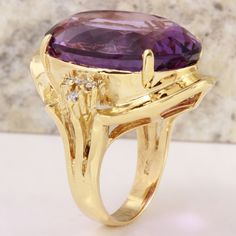 25.25 Carats Natural Amethyst and Diamond 14K Solid Yellow Gold Ring Suggested Replacement Value: $5,900.00 Total Natural Oval Shaped Amethyst Weights: 25.00 Carats (VVS) Amethyst Measures: 22.64 x 16.16mm Natural Round Diamonds Weight: .25 Carats (color G / Clarity VS2-SI1) Ring total weight: 15.2 grams Disclaimer: all weights, measurements and colors are approximate and may vary slightly from the listed dimensions or as seen in the image. All pictures are magnified to show the smallest of deta Luxury Purple Diamond Ring For Formal Occasions, Exquisite Amethyst Ring With Gemstone Accents For Formal Occasions, Formal Purple Diamond Ring With Gemstone Accents, Luxury Yellow Gold Amethyst Ring With Prong Setting, Exquisite Yellow Gold Amethyst Ring With Accent Stones, Luxury Amethyst Ring With Diamond Accents For Anniversary, Formal Amethyst Ring With Diamond Accents, Luxury Amethyst Diamond Ring For Formal Occasions, Formal Amethyst Gemstones With Gemstone Accents