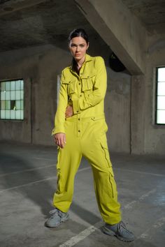 Introducing our Handmade Utility Jumpsuit, a masterpiece of both style and functionality. Crafted with care from high-quality cotton fabric, this jumpsuit embodies the essence of urban chic, designed to empower women who embrace bold choices in their fashion journey. The collared neckline adds a touch of sophistication to the loose baggy fit, striking the perfect balance between comfort and style. Whether you're strolling through the city streets or lounging with friends, this jumpsuit is your i Utility Jumpsuits And Rompers For Workwear, Trendy Summer Overalls With Cargo Pockets, Casual Cargo Jumpsuits And Rompers For Work, Casual Fitted Jumpsuits And Rompers With Multiple Pockets, Fitted Casual Jumpsuits And Rompers With Multiple Pockets, Cargo Style Jumpsuits And Rompers For Spring, Spring Cargo Style Fitted Jumpsuits And Rompers, Utility Jumpsuits With Cargo Pockets For Work, Spring Cargo Style Overalls