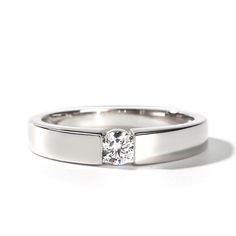 a white gold ring with a single diamond in the center and a thin band around it