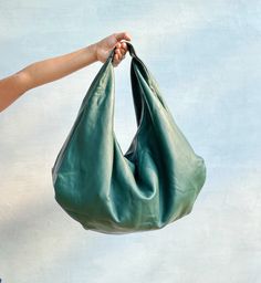 Please read our shipping terms and conditions before placing an order : https://www.etsy.com/listing/1079992551/must-read-alus-indonesia-shipping-terms Choose your own color for a bag that holds your shoulder effortlessly and can take all your necessary everyday items. From weekend, to weekday, this roomy bag goes with many outfits and occasions. Leather is durable, doesn't wrinkle much and comes in a large variety colors and styles. Perfect for every day or work bag and travel bag. To check oth Dark Green Boho, Soft Leather Hobo Bag, Large Hobo Bag, Soft Leather Handbags, Leather Weekender Bag, Best Purses, Large Leather Tote, Hobo Bags, Classic Bags