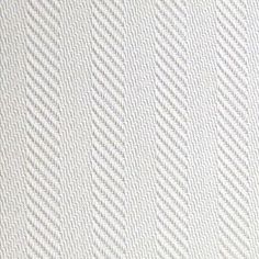 an up close view of white fabric with diagonal lines on it's surface, as well as in the background