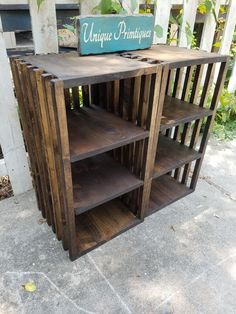 an old wooden bookcase is sitting on the sidewalk