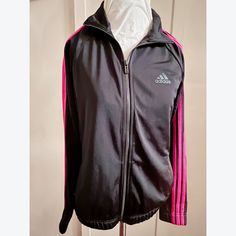 -New Black And Pink Zipper Jacket Includes Side Pockets -Made Of Polyester Includes Signature Adidas Logo On The Front Pink Adidas Sports Outerwear, Pink Adidas Sporty Outerwear, Sporty Pink Adidas Outerwear, Adidas Crop Top, Adidas Cropped Hoodie, Adidas Sports Bra, Adidas Tee, Adidas Crop, Adidas Originals Women