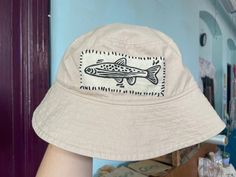 A unisex bucket hat with a handprinted lino patch sewn on. Diy Bucket Hat, Tj Max, Fishing Net, Dream Baby, Embroidered Hats, Block Printing, Bucket Hats, Hat Designs, Block Print