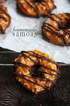 a chocolate covered doughnut sitting on top of a metal tray