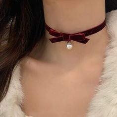 ✦ Breathe festive cheer into every look with this XMAS bunny girl-inspired bow choker necklace! Red velvet and a pearl and heart pendant all come together to create a feminine, fun and party-vibe must-have for the holiday season - a special piece of jewelry to celebrate the festive season! ----------- DETAILS ----------- - Pattern: Pearl Bow/ Bow Heart - Materials: Alloy, Simulated Pearl, Velvet - Length: 28.5cm +6cm - Band Width: 4.7cm - SKU: XL0342 Pearl Necklace With Bow, Necklaces Korean, Tie Choker, Christmas Bow Tie, Bow Choker, Collar Necklaces, Party Vibe, Yule Ball, Red Bow Tie