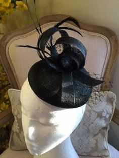 Item:  Black button base fascinator with black feathers, sinamay loops and netting.  size: 14.5 x 3.5cms high (approx), Total height inc feathes (approx 20 cms), length (approx. 20 cms).    Description:  A gorgeous button base sinamay fascinator (in Black) attached with an elastic with black croque feathers, black sinamay loops, netting and biot feathers.  made to order!   Customise: If you would like something added, deleted or changed, please send me a message to see if it is possible. If you Sinamay Fascinator, Black Fascinator, Human Head, Mannequin Heads, Black Feathers, Gift Accessories, Black Button, Fascinator, Halloween Shopping