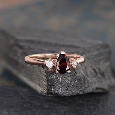 "Three Stone Garnet Engagement Ring Pear Shaped Rose Gold 3 Stone Bridal Diamond Women Anniversary Gift Drop Tear Wedding Rainbow ITEM INFORMATION Metal Type - Solid 14k Rose Gold Band Width - (approx.. 1.5mm) Center Stone - 5*7mm Natural Garnet, Pear Shaped Side Stone - Natural Diamond Weight - 0.12ct Clarity -SI Color - H **Stone Replacement** Available with any other gemstones, please feel free to contact me for a quote. **Metal Type** Available in 14K or 18K yellow gold, white gold, and rose Wedding Rainbow, Engagement Ring Pear Shaped, Ring Pear Shaped, Engagement Ring Pear, Garnet Engagement Ring, Pear Shaped Engagement Rings, Pear Engagement Ring, Rainbow Items, Rose Gold Band