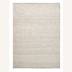 a white rug with some lines on the bottom and one line in the middle, against a white background