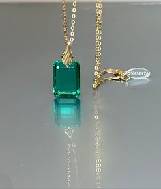 Gorgeous sparkly Colombian emerald pendant necklace. The rectangle shape facet pendant is eye-clean and has gorgeous Caribean ocean green color that brings lots of depth to the stone and reflects lights beautifully. The ultra-fine pendant has great clarity and reflects lights beautifully and is attached to a gold-filled bail and suspended on a 14k gold fill chain. The necklace is elegant and has a lux look. * AAA+ Flawless Faceted Colombian emerald (20 cts) * Pendant size(with the bail): 27x18 m Luxury Green Emerald Cut Necklace, Luxury Emerald Rectangular Pendant Jewelry, Luxury Rectangular Emerald Necklace, Elegant Rectangular Emerald Necklace, Elegant Rectangular Emerald Necklace For Formal Occasions, Formal Emerald Rectangular Pendant Jewelry, Elegant Rectangular Emerald Necklace For Formal Events, Elegant Green Emerald Necklace With Rectangular Pendant, Elegant May Birthstone Necklace With Rectangular Pendant