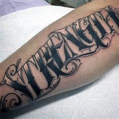 a black and white tattoo with the word faith on it