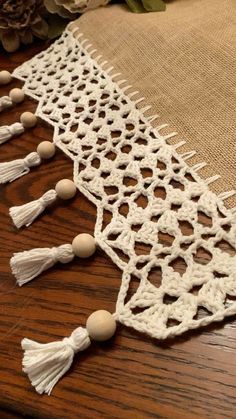 crocheted table runner with tassels and beads