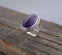 Description Amethyst Ring, Large Silver Ring, Bohemian Jewelry, Birthstone Jewelry, Rings for Women, Birthstone Ring, Oval Stone Ring, Gift Jewelry✦Gemstone: Natural Amethyst✦Stone Shape : Irregular shape Cabochon✦Stone Size: Approximately 13-19 mm✦Metal: 925 Sterling Silver Natural stones may vary slightly in shape, size and color.Handmade ItemYou will receive the same piece as in the picture or identical. Since all gemstones are different from each other, I cannot guarantee that the gemstone you see above will still be available.. But I assure you will get same quality piece as shown in the above picture.# Your order will be dispatch within 3-5 working days after receiving order# Items will be sent via registered airmail and take approx. 15-20 days to arrive. # Express mail Via FedEx/DHL Silver Ring With Stones For Women, Silver Stone Rings Women, Silver Rings For Women Stones, Jewlery Rings, Oval Stone Ring, Silver Jewlery, Silver Rings With Stones, Cabochon Ring, Coin Jewelry