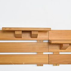 a wooden bench with two benches attached to it's sides and another bench on the other side