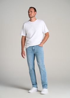 About Our Tall Straight Leg Jeans The OG denim fit in a length that fits your frame. Straight leg jeans for tall men are a must-have in every guy's closet and were one of the original denim styles in the mid-1900s (think James Dean and John Wayne). While jeans have been around for ages, finding options for tall guys has always been a struggle – until now. All of our men's tall jeans are designed specifically for guys between 6'3” and 7'1”. This pair has a bit more room in the hips and thighs wit White Shirt Jeans Outfit Men, Casual Outfits For Tall Guys, Men’s Straight Leg Jeans Outfit, Mens Straight Jeans Outfit, Men’s Blue Jeans, Mens Comfy Outfits Casual, Men’s Simple Style, How To Style Blue Jeans Men, Men’s Straight Leg Jeans