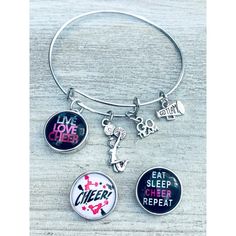 ⭐CHEER JEWELRY - Interchangeable Cheerleading charm bracelet  ⭐CHEERLEADER SNAP BRACELET - Includes 2 Cheerleading Snap Charms. Snap Jewelry is a unique style of interchangeable jewelry that features "snap button charms" that you snap in and out of our stylish bracelet  ⭐ADJUSTABLE - bangle bracelet is adjustable. This wire bangle expands to fit perfectly. Bracelet inner diameter:2.36"-2.56",expands easily to fit most wrist sizes  ⭐CHEER GIFT- Looking for an inexpensive cheer gift to show your team spirit? Got a birthday, holiday, or other special occasion coming up for the cheerleader in your life? This pretty yet inexpensive sports bracelet makes a great gift, whether for a friend, daughter, cheer mom, or teammate.  ⭐DESIGNED & SOLD BY Infinity Collection- A USA family owned business. Ou Cheer Jewelry, Button Charms, Cheer Gifts, Interchangeable Jewelry, Sports Bracelet, Adjustable Bangle Bracelet, Snap Bracelets, Wire Bangles, Stylish Bracelet