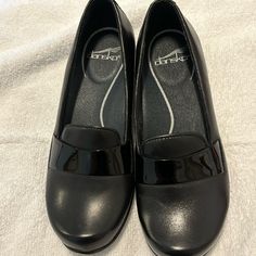 Dansko Women’s Size 37, European 6.57 Us New Without Tags Black Never Worn, 1 Inch Heel Black Heels With Cushioned Footbed For Work, Black Slip-on Heels For Work, Dansko Black Boots, Dansko Rowan, Black Slip-on Heels With Ortholite Insole, Black Heels With Ortholite Insole, Medium Width, Dansko Shoes, 1 Inch, Womens Sizes