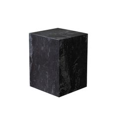 a black marble cube on a white background