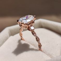 an engagement ring is sitting in a box