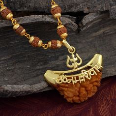 The One mukhi Rudraksha is blessed by Lord Shiva and its controlling planet is the Sun. It is beneficial for those desiring excellence in meditation, yoga and growth. It is excellent for spiritual growth, meditation and developing better focus. This Rudraksha negates the malefic effects of Sun. Rudhraksh Chain Length-66 CM X Width -6 MM, Pendant Width -3.5 CM,Pendant Length-3.8 CM Material : Brass Care instructions: Keep this product away from sprays, water and other corrosive liquids 1 Mukhi Rudraksha Pendent, Spiritual Necklace For Puja And Diwali, Gold Mala As Navratri Gift, Gold Mala For Navratri Gift, Spiritual Necklace For Diwali Puja, Gold Mala For Puja And Navratri, Gold Mala For Navratri Puja, Gold Mala For Navratri Rituals, Gold Mala For Puja During Navratri