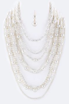 Enhance your everyday look with the stunning Million Pearls Layer Necklace Set. With layers of lustrous pearls, this set adds elegance and sophistication to any outfit. The perfect accessory for a night out or a special occasion. Elevate your style and make a statement with this beautiful necklace set. SPECIFICATIONS: Necklace - 17" + Extension Earrings - 1.85" Drop Lead & Nickel Compliant Classic Pearl White Necklace For Party, Classic Pearl White Pearl Necklace For Party, Classic Pearl Embellished Necklaces For Party, Classic Pearl-embellished Necklace For Parties, Party Beaded Pearl Necklaces With Pearl Pendant, Party Pearl Beaded Necklaces With Pearl Pendant, Party Pearl Necklace With Pearl Pendant, Classic Pearl Necklace For Party, Party Pearl Beaded Necklace With Pearl Pendant