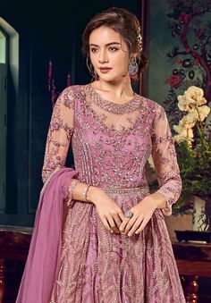 COLOR : Charm Pink FABRIC : Top - Net, Bottom (Lehenga) - Satin, Inner - Santoon, Dupatta - ChiffonWORK : Heavy Resham Work, Tonal Glitter Cord, Sequins, Stones, Motifs, Lace Border OCCASION : Wedding, Reception, Engagement READY-TO-WEAR : NoSTITCHING : Available as semi-stitched fabric, can be stitched using standard size option (+$30). Note: There might be a slight color variation due to lighting and flash used during photoshoot. The bright shade seen is the best closer view of fabric's color. Wedding Anarkali, Top Net, Resham Work, Anarkali Gown, Lace Border, Pink Fabric, Anarkali, Fabric Color, Lehenga