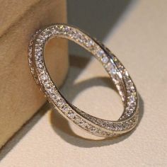 a diamond ring sitting on top of a box