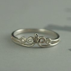 a silver ring sitting on top of a table