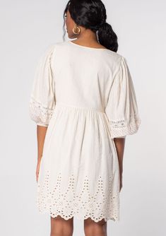 Classic bohemian details and effortless Summer style come together in this timeless cotton mini dress. Designed in a textured dobby and a contrast mini red dot print, featuring a flowy embroidered skirt, a split v-neckline with tassel tie accents, and voluminous long sleeves with sheer lace trim. An essential warm-weather style that pairs effortlessly with a lace-up sandal. FINAL SALE Dobby and dot print Embroidered Relaxed, flowy fit Voluminous long sleeve Elastic wrist cuff Split v-neckline wi Bohemian V-neck Embroidered Dress For Brunch, Cotton V-neck Mini Dress With Lace Trim, V-neck Dresses With Embroidered Hem For Brunch, Flowy Cotton Boho Dress With V-neck, Peasant Style Embroidered V-neck Dress, Bohemian Cotton Dress With Cutwork Hem, Bohemian Knee-length Mini Dress For Daywear, White Peasant V-neck Dress, Spring Bohemian Dress With Cutwork Hem