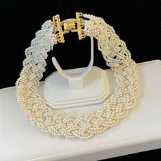 Vintage Braided White Faux Pearl Collar Necklace Elegant Flat Braided Design With Gold Tone Fold Over Clasp Closure Dimensions: 17 3/4” L X 1” W Pearl Collar, Elegant Flats, Necklace Elegant, Braid Designs, Collar Necklace, Fold Over, Womens Jewelry Necklace, Faux Pearl, Vintage Shops