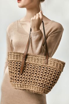 Lightweight but sturdy, our woven straw bag’s unique combination of traditional weaving techniques mean its a stylish everyday companion. Its leather handles mean it can easily be carried in the hands or worn over the shoulder. B003Z-NYY1 Braided Jute Bags, Travel-friendly Woven Light Brown Shoulder Bag, Travel Shoulder Bag In Woven Leather And Rattan, Light Brown Woven Shoulder Bag For Travel, Travel Light Brown Woven Shoulder Bag, Chic Beige Braided Straw Bag, Light Brown Straw Shoulder Bag For Spring, Spring Light Brown Straw Shoulder Bag, Beige Braided Crochet Bag