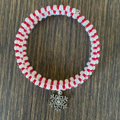 Handmade Christmas Wrap Bracelet Is Made To Look Like A Candy Cane, With Red And White Seed Beads, And A Silver Plated Snowflake Charm One Size Fits Most Red Seed Beads White, Pearlized Seed Beads Silver Plated Snowflake Charm Handcrafted By Me Gift Boxed, Ready To Wrap I Always Ship Same Day Or Next Business Day Custom Orders Are Always Welcome Any Questions Please Ask! Women’s Jewelry Women’s Bracelets Holidays Women’s Accessories Christmas Bracelets Holiday Bracelets Wrap Bracelets Festive Memory Bracelets Candy Canes Snowflakes Casual Contemporary Seasonal Winter Layered School College Office Festivals Concerts Parties Celebrations Gradu Christmas White Bracelets With Colorful Beads, White Christmas Bracelets With Colorful Beads, White Bracelets With Colorful Beads For Christmas, White Beaded Christmas Jewelry, White Christmas Jewelry With Colorful Beads, Red Beaded Bracelet With Colorful Beads For Christmas, Red Beaded Bracelets With Colorful Beads For Christmas, White Round Bead Bracelets For Holiday, White Adjustable Beaded Bracelets For Christmas