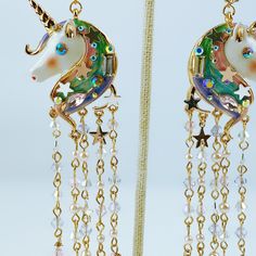 Product Details Flash a little magic with these unicorn fringe chandelier earrings by Betsy Johnson. Set in gold-tone mixed metal; glass; plastic Approx. drop: 4-3/4" Lever back closure Photo may have been enlarged and/or enhanced. Imported Whimsical Jewelry With Dangling Charms For Party, Gold Fantasy Earrings For Party, Fringe Chandelier, Betsy Johnson, Mixed Metals, Chandelier Earrings, Betsey Johnson, Crystal Beads, Turquoise Necklace