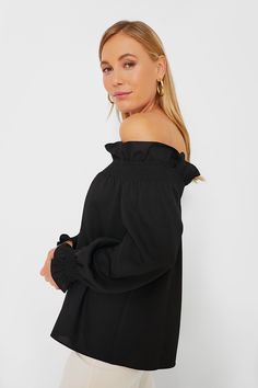 Our favorite lady, Marguerite, is back and better than ever. Add a bit of off the shoulder sass to your look with a structured elasticated ruffle neckline and cuffs. We are styling this top with fun statement earrings and heels for date night and dinner with friends all year long. Off-the-shoulder neckline Elasticated shoulder with ruffle trim Long sleeves Elasticated cuffs Relaxed fit Material: 100% polyester Care: Machine wash cold Off-shoulder Top With Smocked Bodice For Fall, Off-shoulder Ruffled Tops For Brunch, Fitted Off-shoulder Top With Elastic Sleeves, Fall Off-shoulder Blouse With Blouson Sleeves, Off-shoulder Blouse With Blouson Sleeves For Fall, Fall Blouse With Blouson Sleeves And Off-shoulder Design, Off-shoulder Top With Ruffles For Brunch, Chic Smocked Top With Elastic Neckline For Brunch, Off-shoulder Ruffled Tops For Night Out