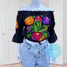 "Beautiful Mexican off the shoulder bell sleeve floral embroidered crop top with elastic around the waist and shoulders. Made out of manta, 100% cotton. Please note: Each top is unique, the embroidery may be slightly different from the one pictured. Dimensions: Small Bust- 38\" Length- 16\" Medium Bust- 41\" Length- 16\" 🧵Made in Chiapas, Mexico. 🧺Care Instructions: We recommend hand washing, air dry. 📲Please feel free to message me with any questions regarding sizing and fit. Additional phot Fitted Floral Embroidered Crop Top For Festival, Multicolor Floral Embroidery Peasant Top, Embroidered Fitted Bohemian Crop Top, Bohemian Off-shoulder Top With Floral Embroidery, Spring Floral Embroidered Off-shoulder Tops, Mexican Embroidered Dress, Fiesta Dress, Bell Sleeve Crop Top, Embroidered Crop Tops