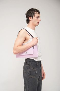 Baguette revisits the silhouette of a classic baguette bag and turns it into a resolutely Avant-Garde piece. This bag can be worn on the shoulder or in hand, and will safely hold any essentials you need. Italian semi-patent Boxcalf leather Inner pocket Metallic clasp closure Embossed Audette logo Made in Spain All accessories are considered final Baguette Bag, Pink Bag, Baby Pink, Final Sale, Spain, Turn Ons, Leather, Pink, Baguette