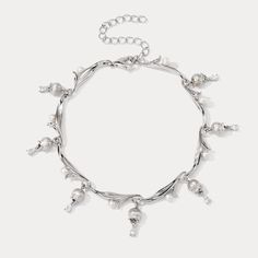 Elevate your style with the 925 Sterling Silver Lily of the Valley Bracelet, a silver diamond bracelet that epitomizes timeless grace. Exquisitely encased in premium 925 sterling silver, this elegant piece features delicate lily of the valley motifs accented by sparkling cubic zirconia stones that mimic the radiance of diamonds. Its refined design seamlessly transitions from day to night, adding a touch of sophistication to any ensemble while embodying the eternal beauty of nature's precious blo Elegant Charm Bracelet With Sterling Silver Clasp, Luxury Silver Pearl Bracelet With Oyster Detail, Silver Pearl Bracelet For Anniversary, Fine Jewelry, Elegant Jewelry With Silver Accents And Adjustable Fit, Elegant Sterling Silver Chain Bracelet For Party, Fine Jewelry Silver Pearl Bracelet For Anniversary, Elegant Adjustable Jewelry With Silver Accents, Elegant Silver Chain Charm Bracelet For Formal Occasions, Luxury Silver Diamond Bracelet With Oyster Design