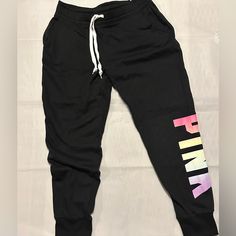 Nwt Size M, Super Soft, Victoria's Secret Pink Everyday Lounge Skinny Jogger Color Black Rainbow Everyday Lounge Skinny Jogger Slim-Tapered Fit Adjustable Drawstring Waistband Ribbed Banded Bottom Side Pockets Pink Athleisure Joggers With Drawstring, Pink Drawstring Sweatpants For Loungewear, Pink Casual Joggers With Drawstring, Pink Drawstring Casual Joggers, Pink Drawstring Lounge Pants, Pink Drawstring Pants For Loungewear, Pink Drawstring Loungewear Pants, Trendy Pink Sweatpants With Drawstring, Pink Stretch Trendy Joggers