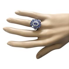 Stamped: 14K White Gold Total Ring Weight: 5.8 Grams Ring Length: N/ARing Width: N/A Gemstone Weight: Total Natural Tanzanite Weight is 4.42 Carat Quantity: 15 Color: Blue Diamond Weight: Total Natural Diamond Weight is 0.35 Carat Quantity: 14 Color: F-G, Clarity: VS2-SI1 Face Measures: 20.35x17.40 mm Sku: [703911W] 14k White Gold Diamond Ring, Tanzanite Diamond Ring, Natural Tanzanite, White Gold Diamond Rings, Blue Diamond, White Gold Diamonds, Precious Metals, Sapphire Ring, Gold Diamond