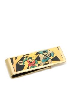 a gold tie bar with an image of two superheros on the front and back