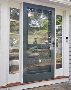 the front door of a house with a star on it