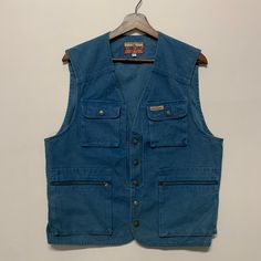 [DESCRIPTION] Please read the description first before buy my items‼️‼️ Vintage EvenRiver Workwear Multipocket Denim Vest Size on tag : L Tag says L,fits like M All in good condition [MATERIAL] Denim [MEASUREMENT] Measurement:  armpit to armpit : 21 inches  Back collar to bottom : 24 inches [CONDITION] - All in good condition  - No hole no rip no stain [PAYMENT & NOTICE] - We accept PayPal ONLY - No return/refund - All items will be post over shipping company counter within 1-3 working days afte Casual Washed Blue Denim Vest With Pockets, Casual Cotton Denim Vest With Pockets, Casual Denim Vest With Pockets For Workwear, Button-up Cotton Denim Vest With Pockets, Cotton Button-up Denim Vest With Pockets, Cotton Denim Vest With Pockets, Button-up Denim Vest For Work With Pockets, Utility Denim Vest With Pockets, Blue Button-up Denim Vest With Pockets