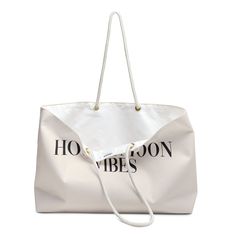 Embrace Honeymoon Bliss with Our 'Honeymoon Vibes' Tote. Whether strolling along sandy shores or exploring new destinations, this spacious tote embodies honeymoon chic, offering ample room for essentials while exuding effortless style. .: One size: 24" x13" (60.9 cm x 33 cm).: 100% Spun Polyester.: T-bottom.: Cream sheeting interior lining.: NB! Size tolerance 0.75" (1.9 cm)).: Assembled in the USA from globally sourced parts Sand-colored Travel Bags For Beach Season, Beige Large Capacity Beach Bag For Travel, Vacation Canvas Bag With Large Capacity For Daily Use, Large Capacity Beige Beach Bag For Travel, Large Capacity Sand Shoulder Bag For Beach Season, Large Capacity Sand Tote Bag, Sand Colored Travel Bags For Beach Season, Large Capacity Canvas Bag For Daily Use And Vacation, Large Canvas Shoulder Bag For Vacation