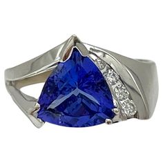 Beautiful 4.00 ct. tanzanite trillion with 0.15 ct. good quality white diamond rounds. Handmade in 14k white gold. Ring size 9.5.