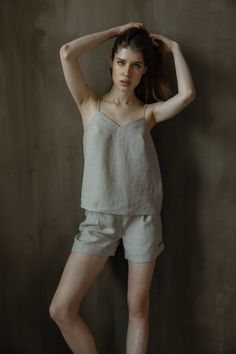 Skin friendly 100% linen top is for timeless wearing. This model features adjustable straps. Lightweight linen tank top can be paired with denim, shorts or even skirts so it's easy to wear in your daily life during tropical summer weather or as a layer with blazer during chilly evenings.  Camisole design delivers minimalist design for your daily outfit.  Adjustable spaghetti strap top is so easy to wear.  Basic top LINDA is handmade of 100% pure linen.  Model is 5.9ft (180cm) tall, wearing size Summer Loungewear Camisole, Linen Tank Top For Vacation, Spring Linen Tank Top, Summer Camisole With Adjustable Straps For Loungewear, Spring Sleeveless Linen Camisole, Spring Linen Camisole Top, Summer Linen V-neck Camisole, Spring Linen Tank Top With Relaxed Fit, Summer Linen Camisole Tank Top